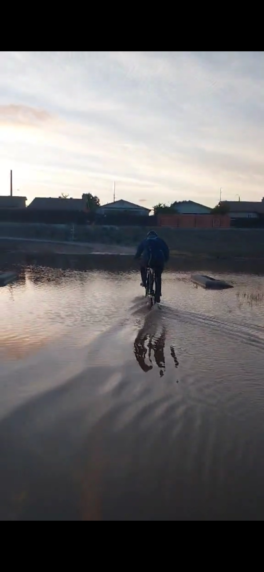 Well...... it turns out that we still had to pass through it anyway. (I wasn't looking ahead of me and ended up riding off of the road and filled my shoes with water)