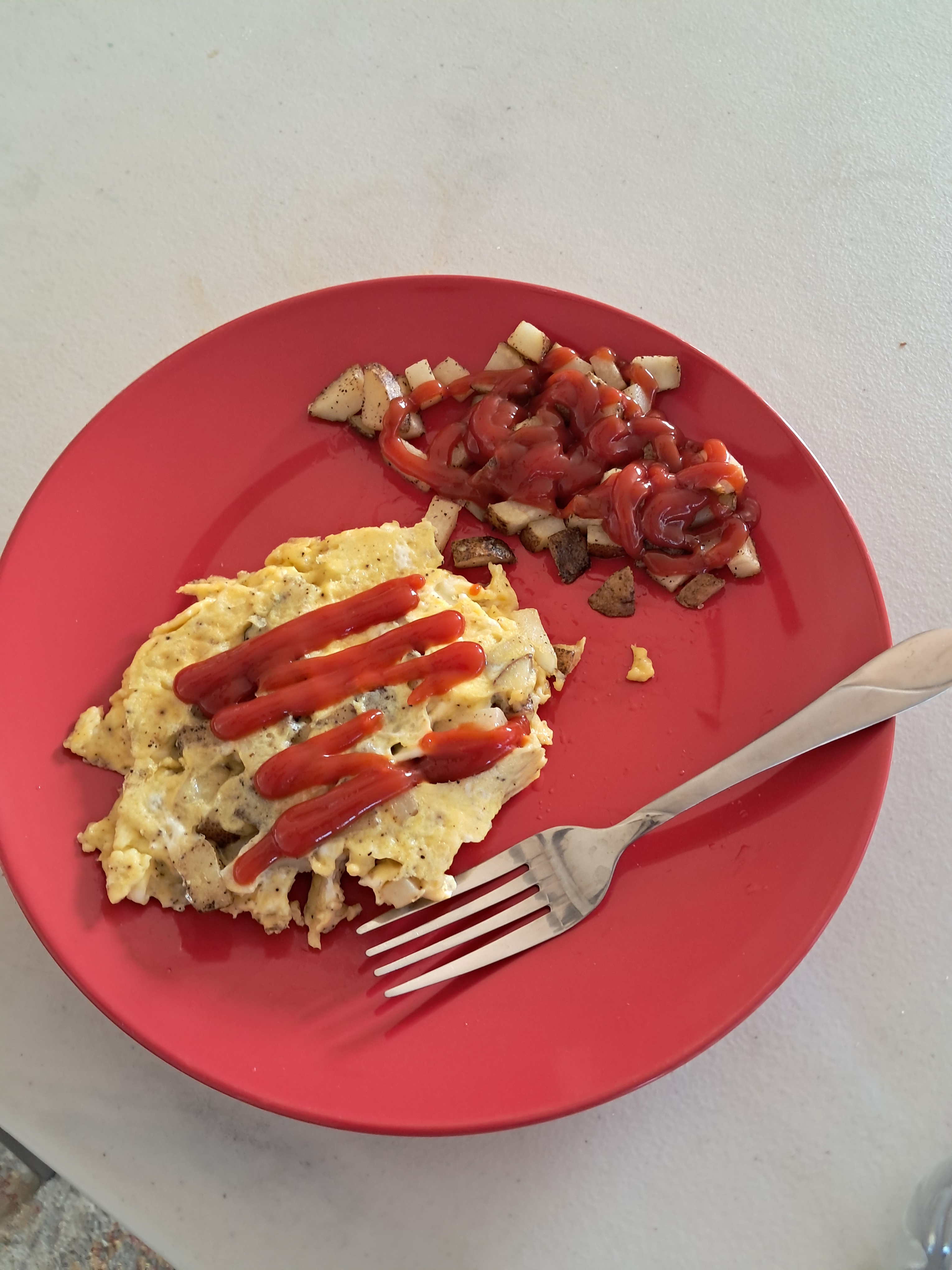 My breakfast I made. A potato omelet with a side of potatoes.