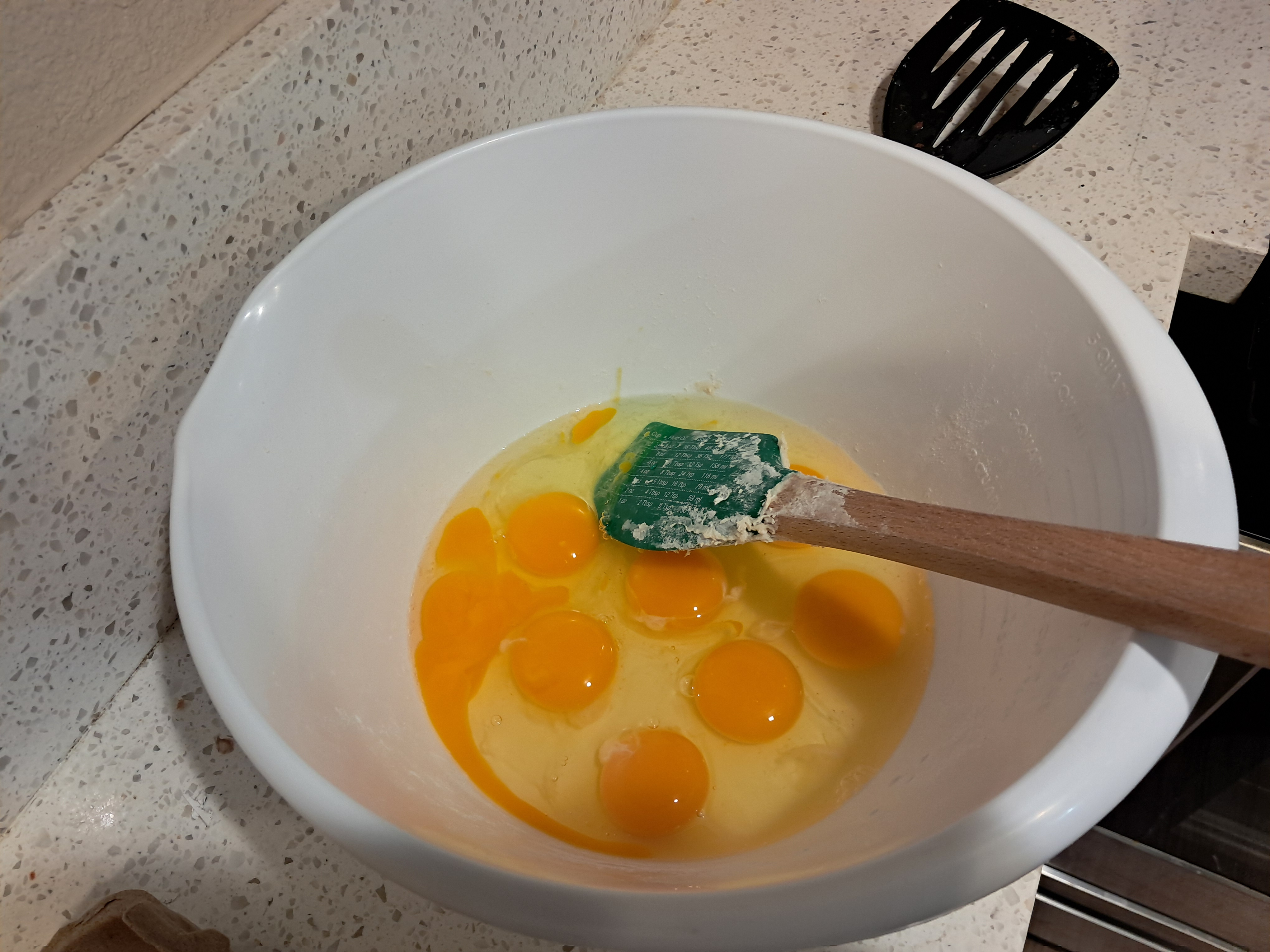 It all started on Sunday night after 9 when I began making the calzones. (We have a lot of leftover ham so I wanted to make breakfast calzones) So I started with the eggs and dough. But I didn't mix in the yeast because I figured I wasn't going to be able to finish this before bed. (Also, I didn't know this but we didn't have milk for the alfredo sauce) I also cut up ham but I don't have a picture.