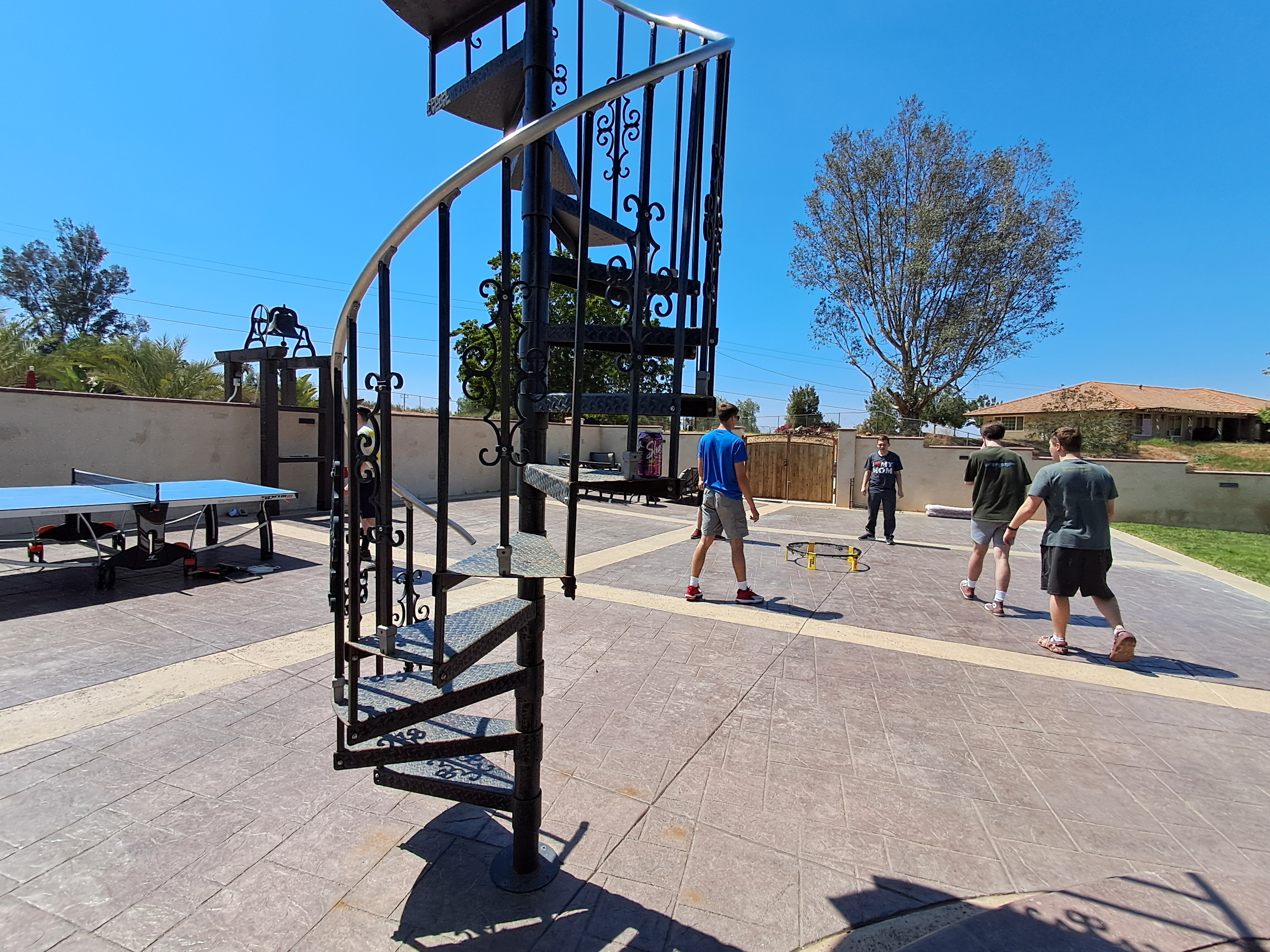 Stairs leading up to a big tree house.