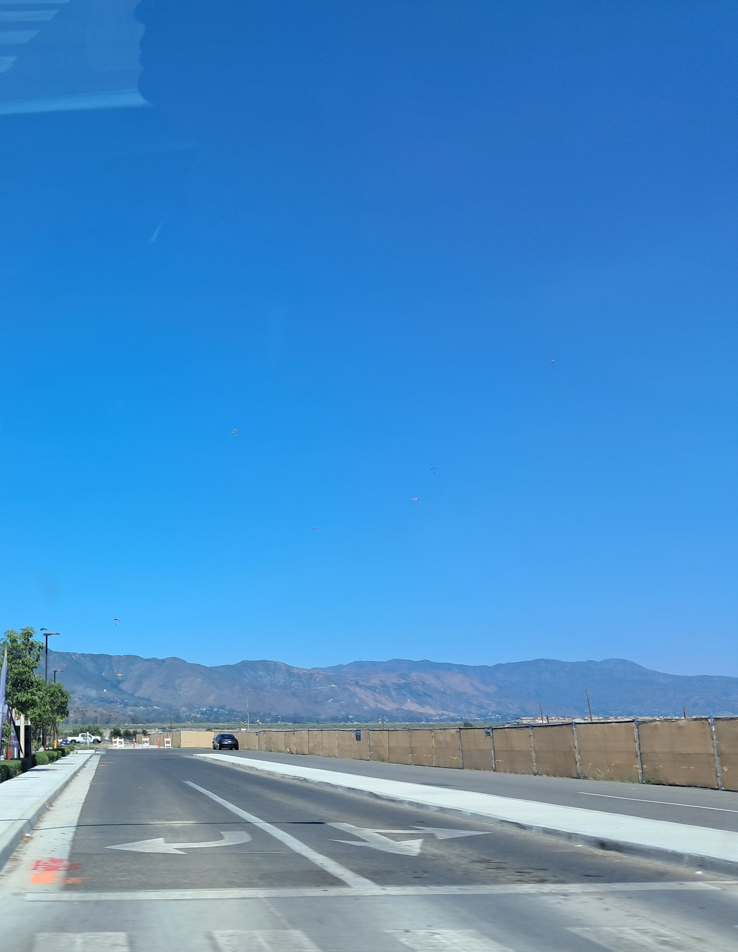 If you look close enough there are indeed people parachuting.