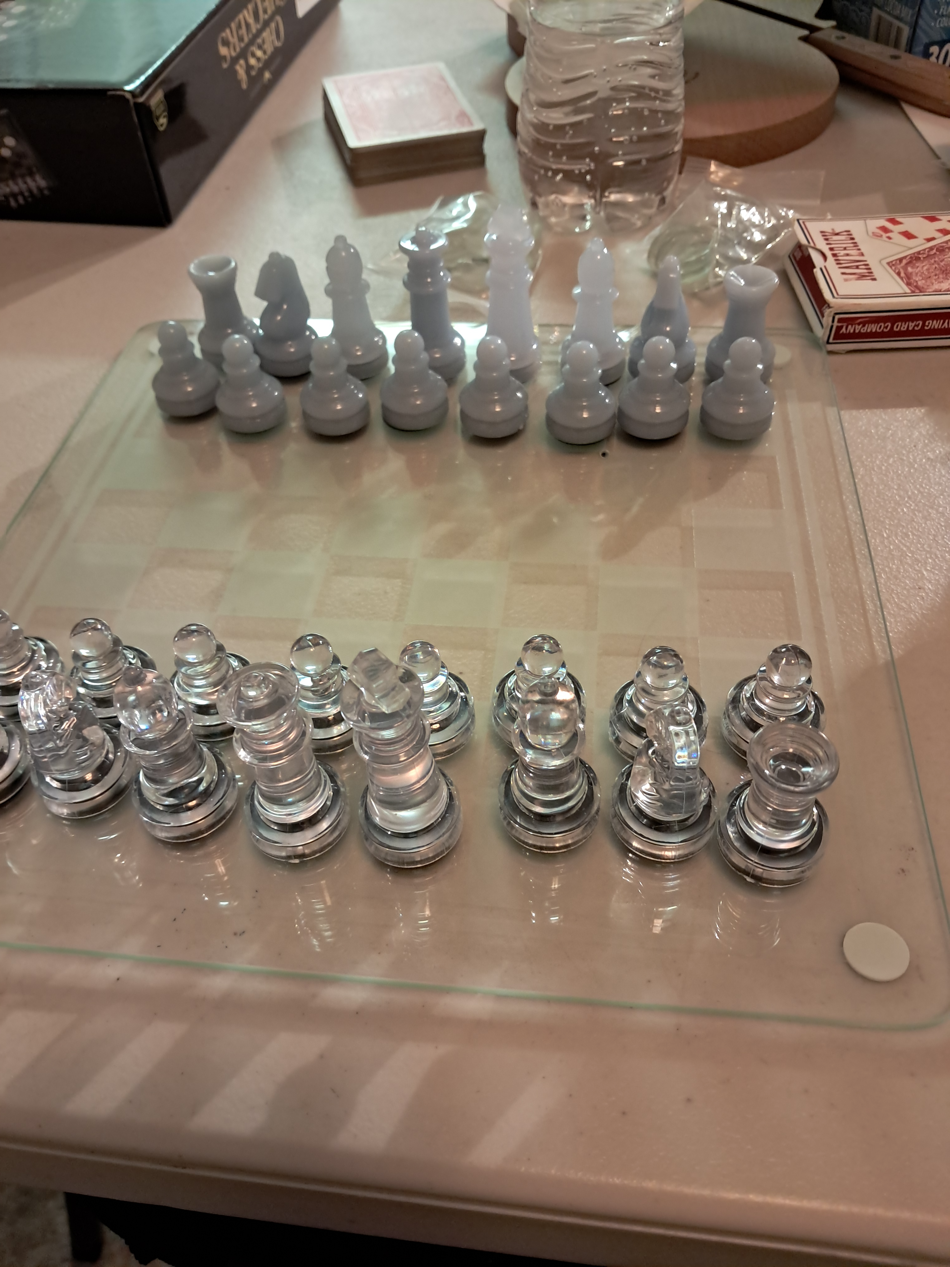 Elder Squires bought this with his gift card some members gave us. It was only 10 dollars and the pieces are plastic and the board and checkers are glass.