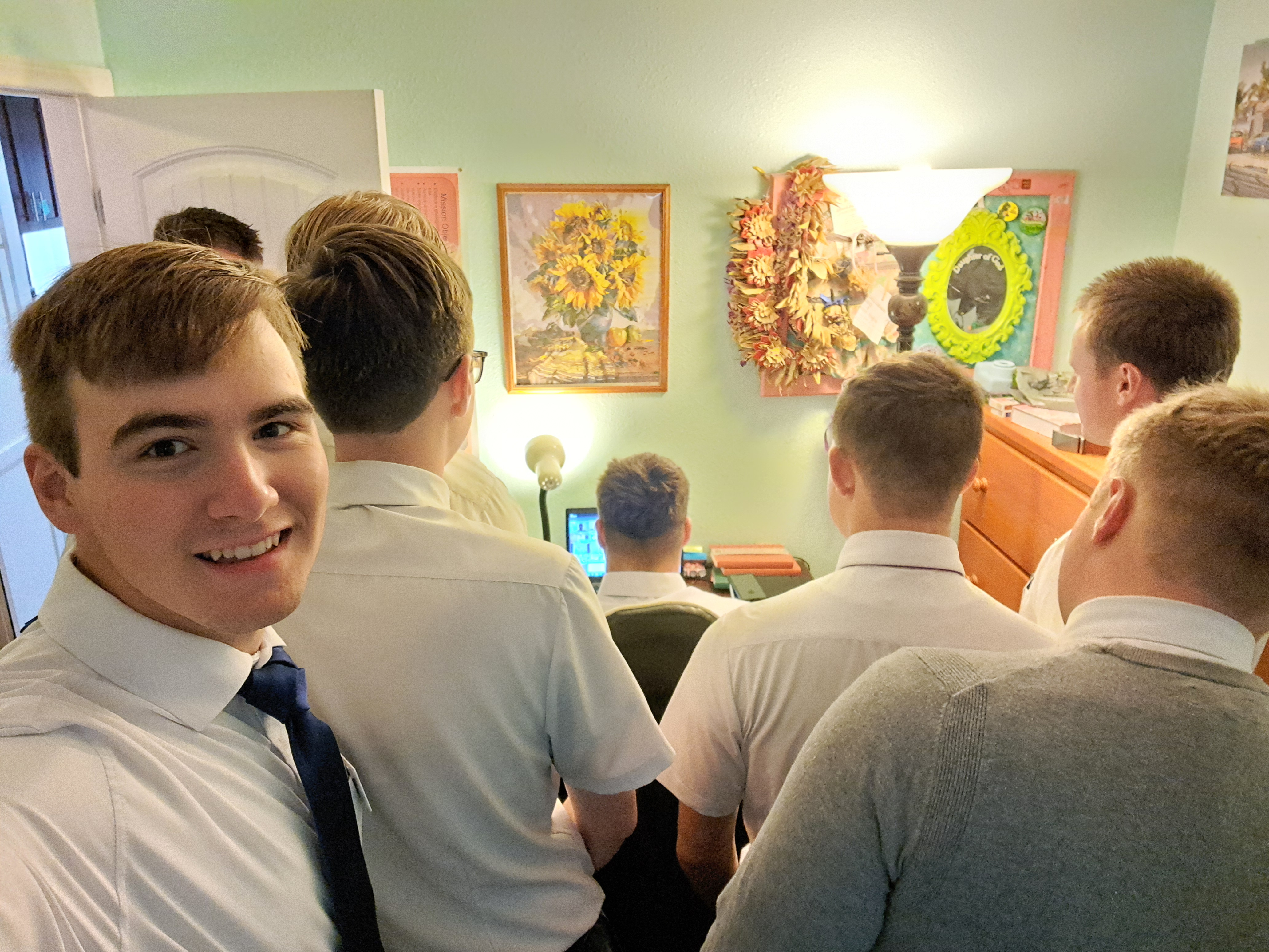 The stake president told us to go into his son's room while he is doing home MTC. So... we did and did the ultimate prank! It was funny and he got to explain to the rest of the class why there is a ton of missionaries behind him. 
For more context his dad was hosting two zones of missionaries for a breakfast. It was really good! Unfortunately I didn't take a picture.